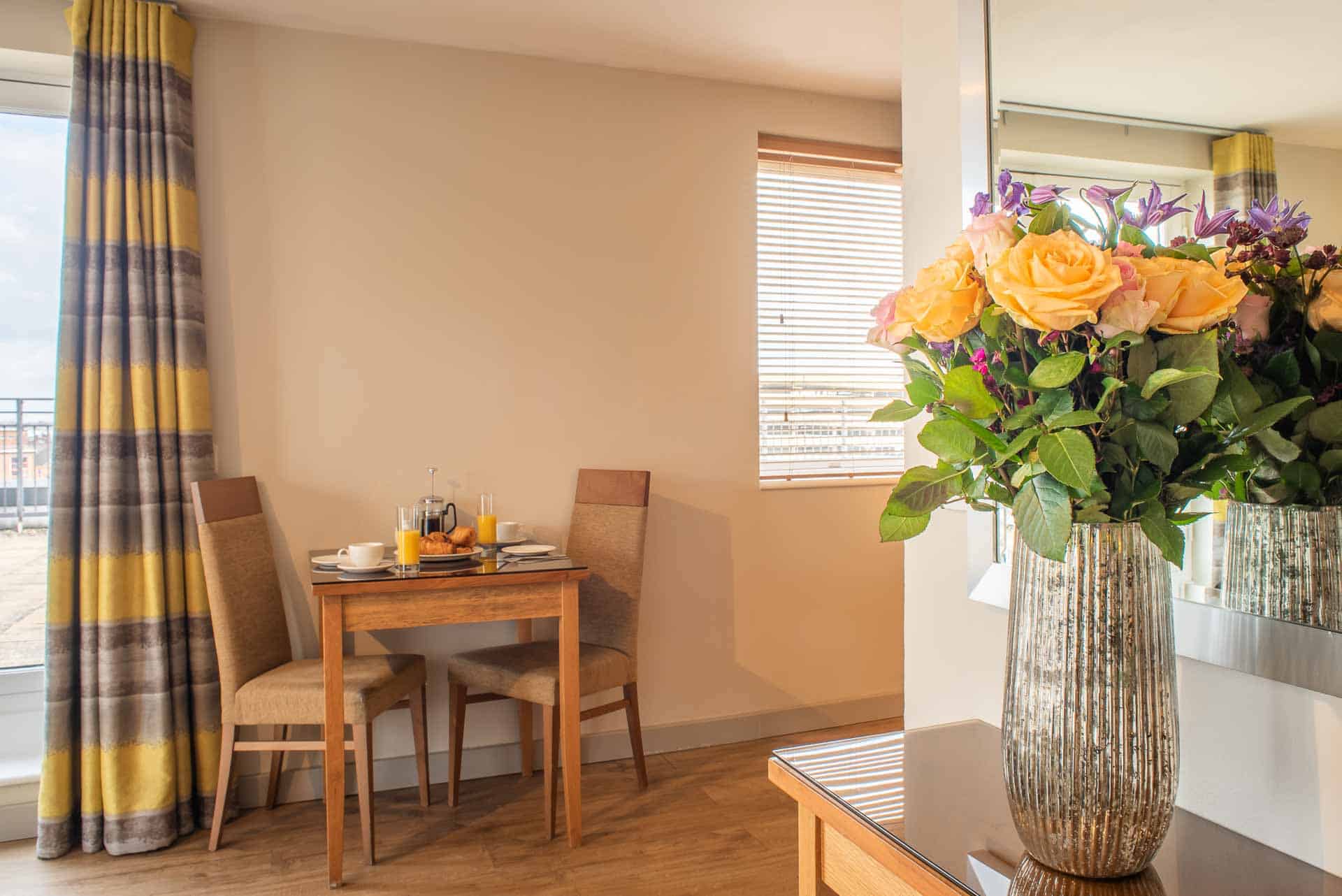 Dining table set for breakfast at PREMIER SUITES Birmingham