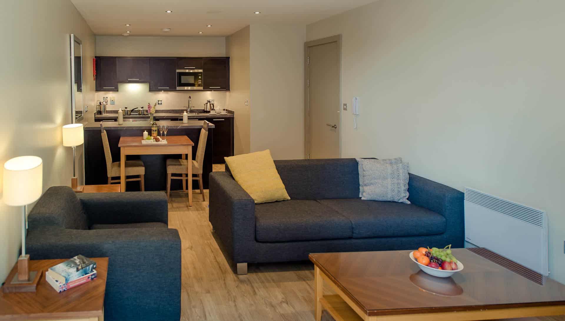 PREMIER SUITES Manchester living, dining and kitchen area of one bedroom apartment