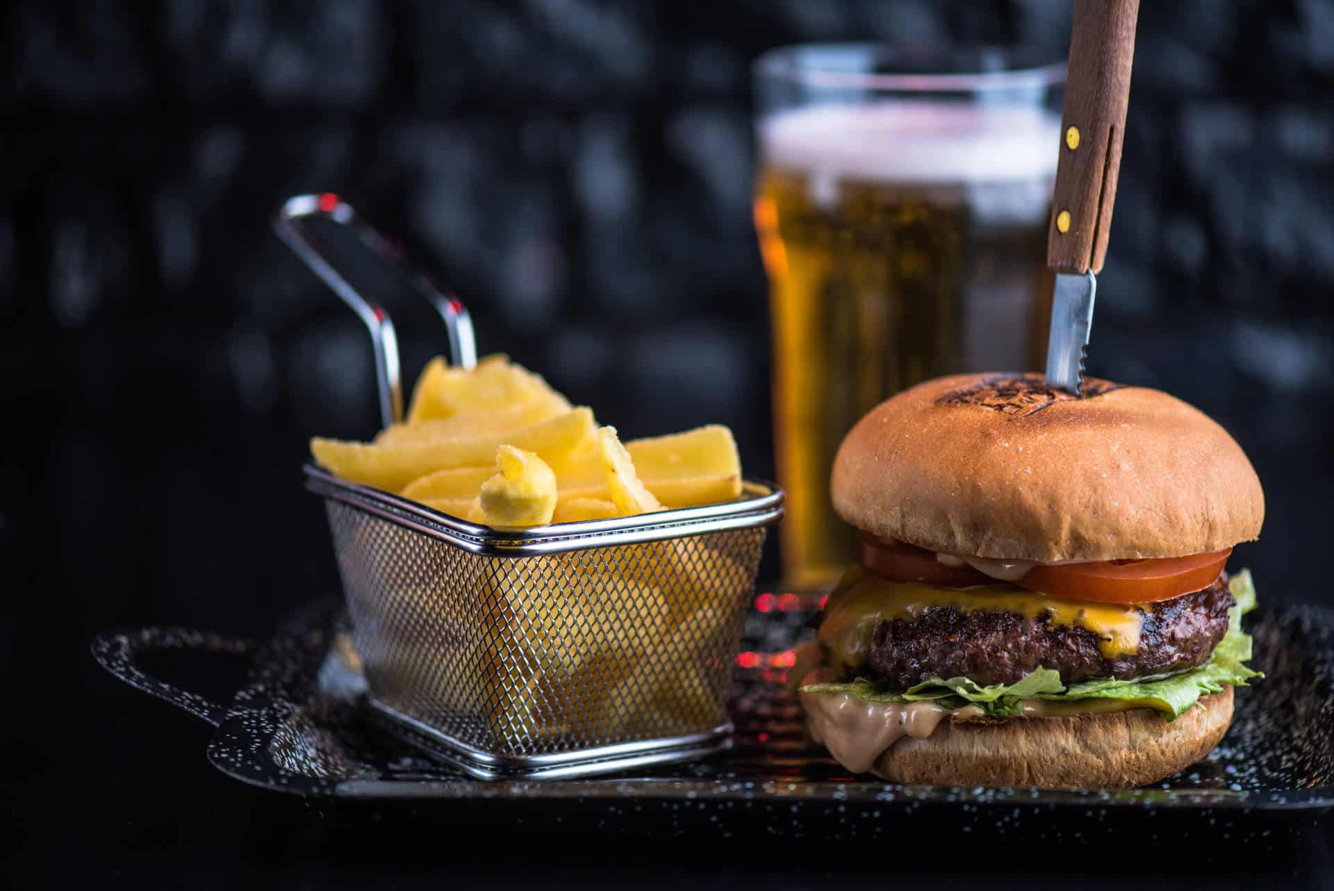 Burger, chips and pint of beer.