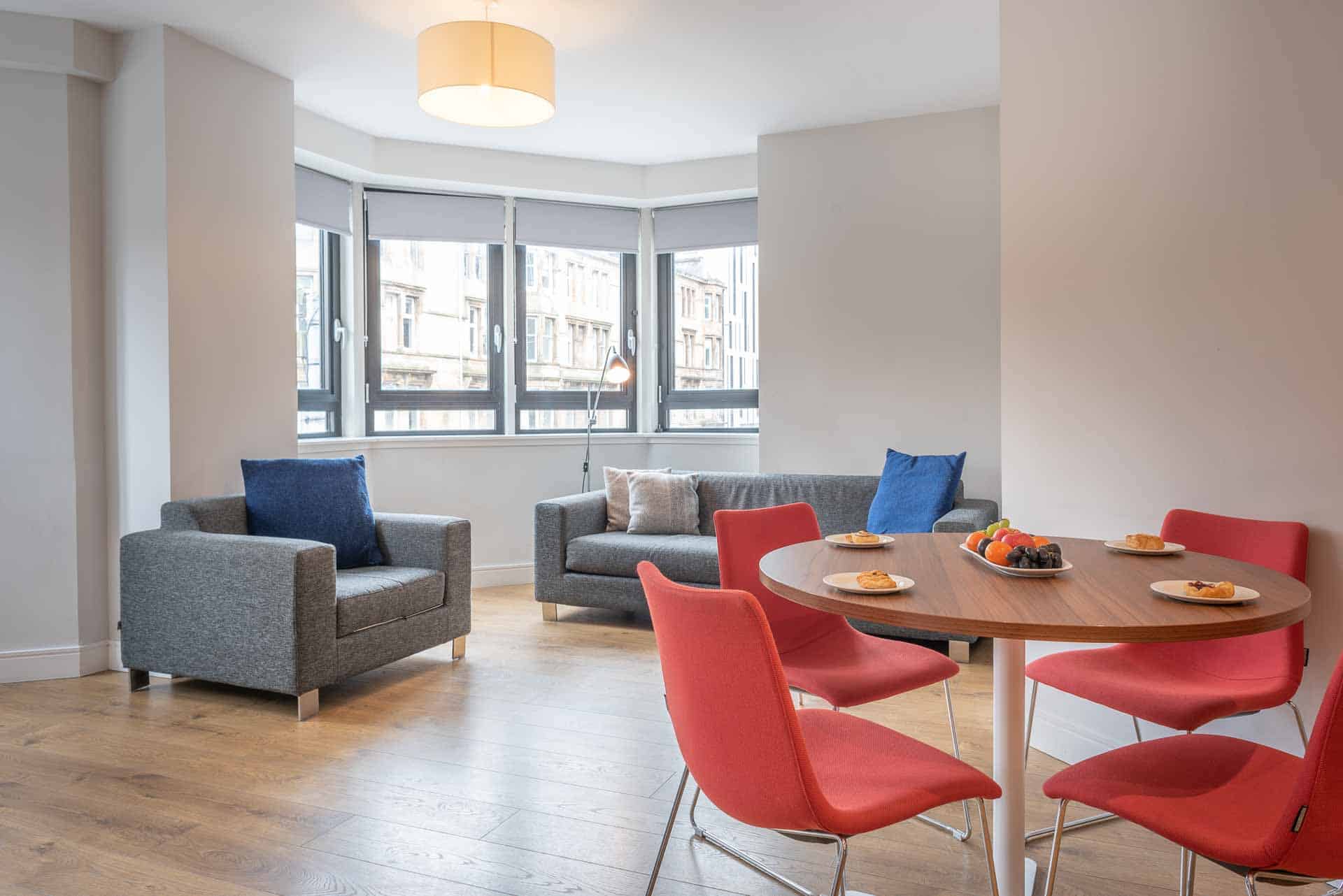 Open plan lounge in serviced apartments at PREMIER SUITES PLUS Glasgow Bath Street