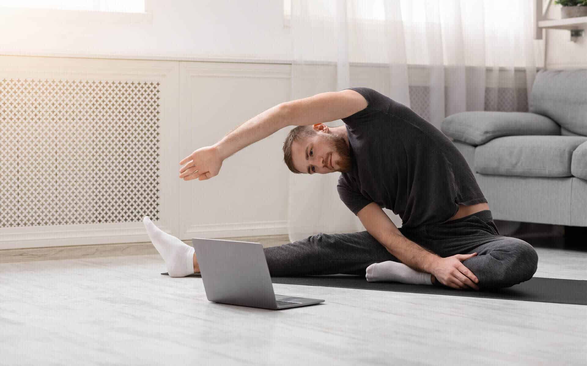PS Life man stretching in apartment