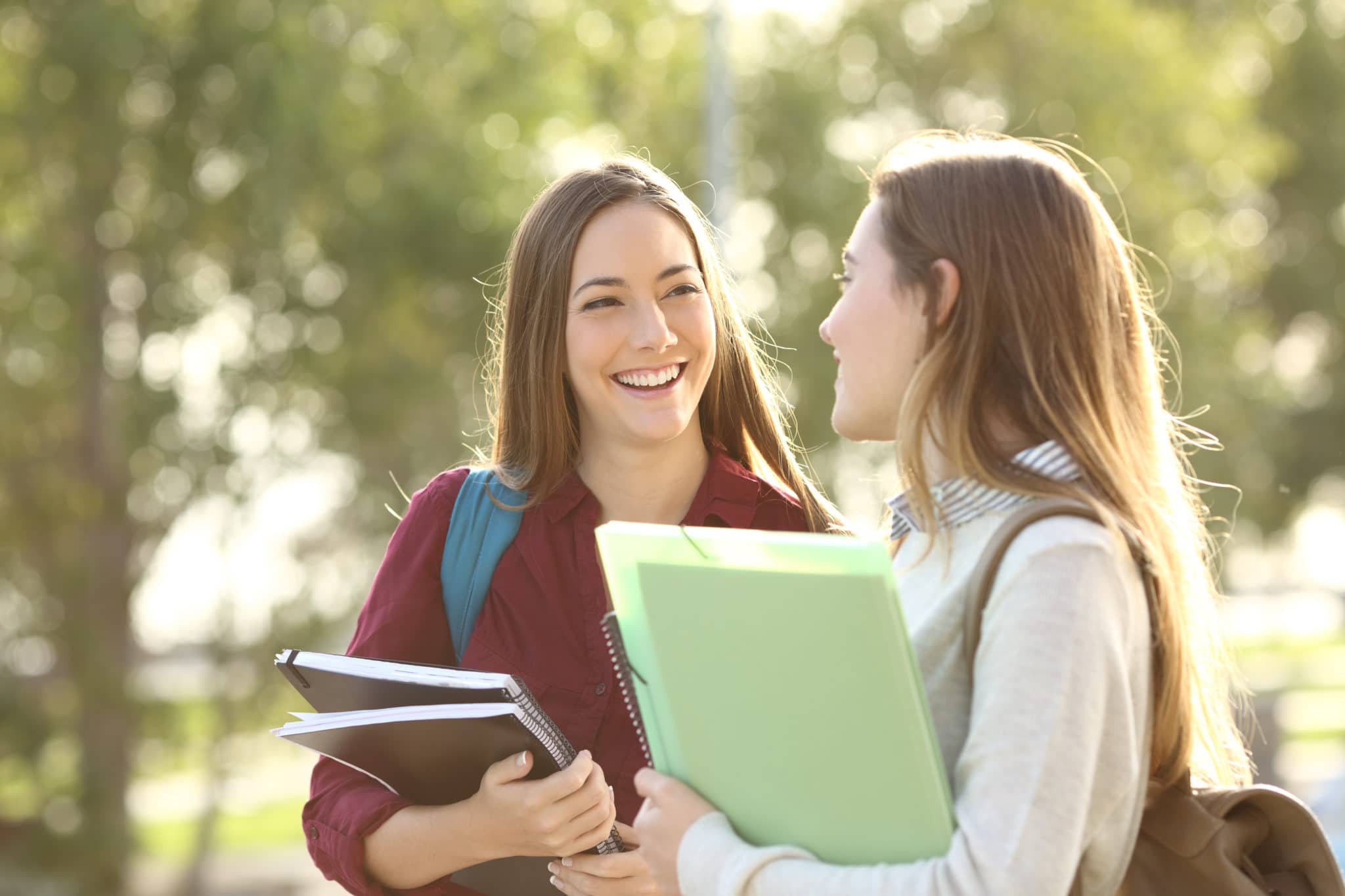 Two girl students chatting