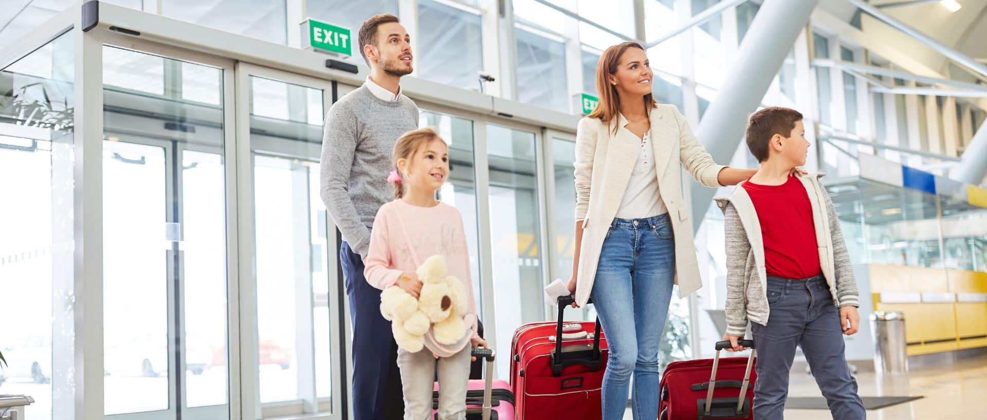 Family walking through the airport