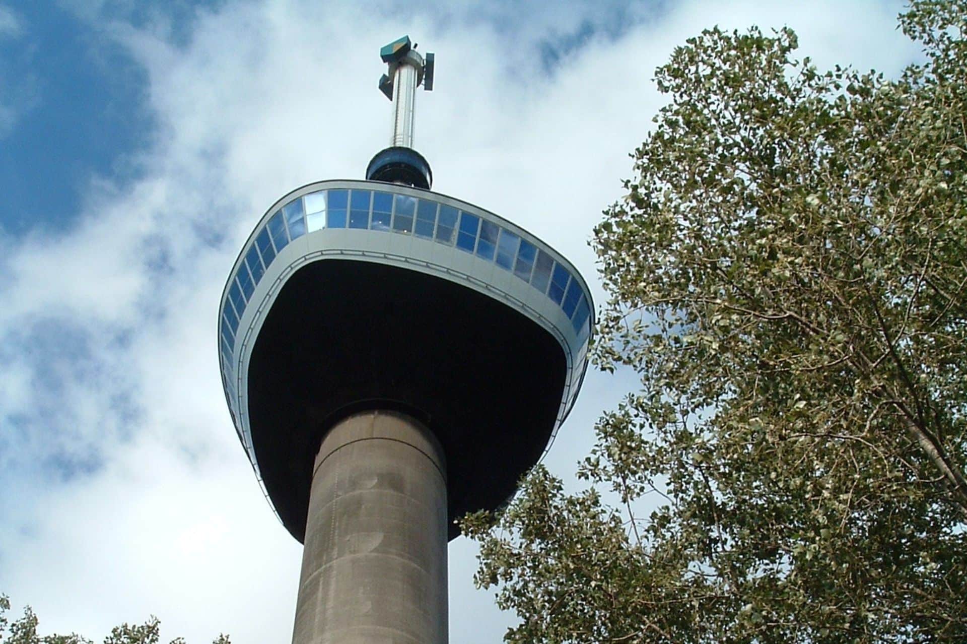 a tall tower with a windmill on top of it