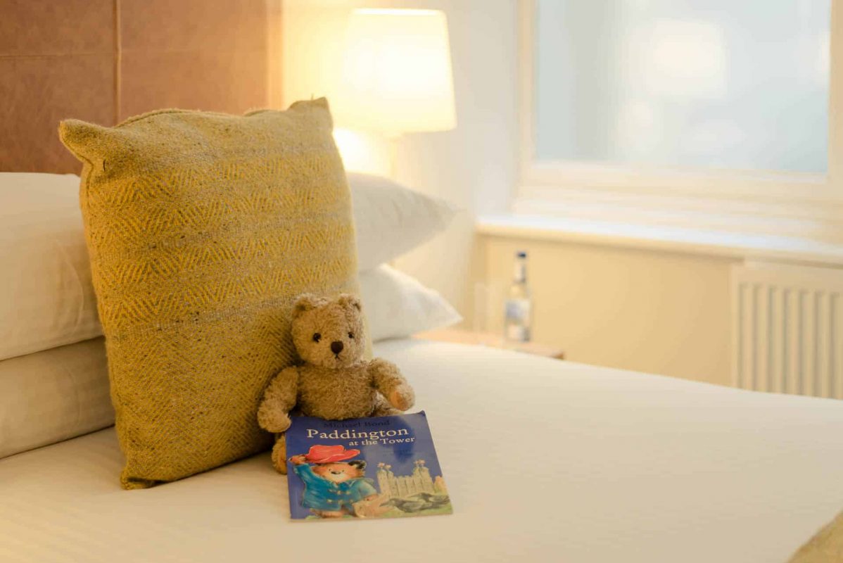 Childrens book and teddy on a bed PREMIER SUITES PLUS Glasgow George Square