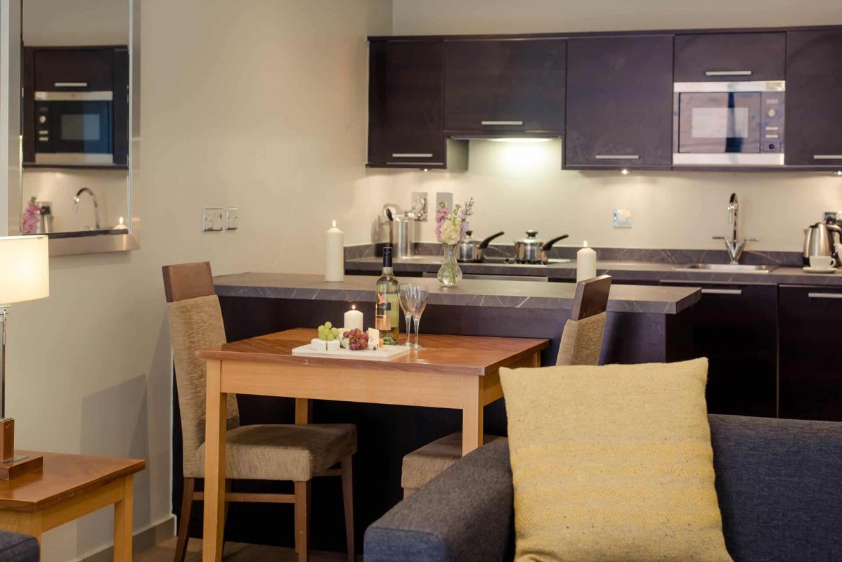 PREMIER SUITES Manchester one bedroom apartment dining and kitchen area