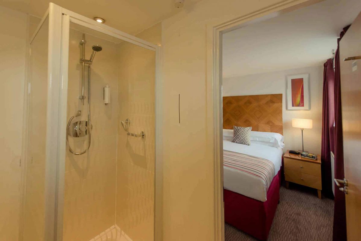 PREMIER SUITES Newcastle Ensuite Shower and Spacious Bedroom